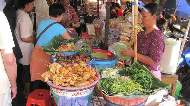 A lady sells Pecel, traditional cuisine, Beringharjo, Yogyakarta, Indonesia